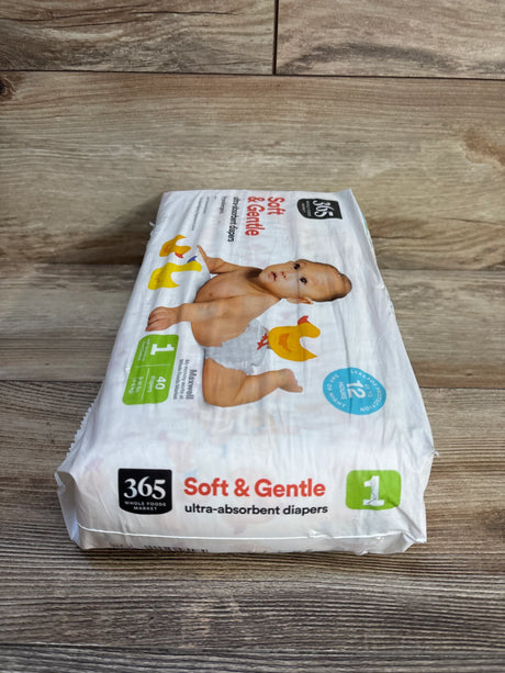 365 Whole Foods Market Soft & Gentle ultra-absorbent baby diapers, size 1, 40 count, on wood floor