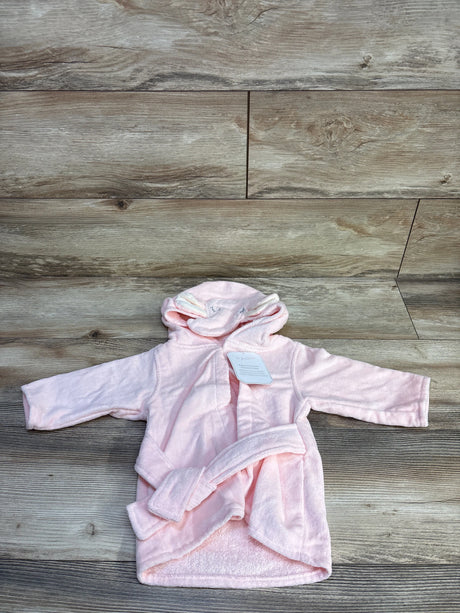 Front view of pink Le Petit Elephant hooded baby bathrobe showcasing attached hood with elephant ears and matching belt on wood floor background