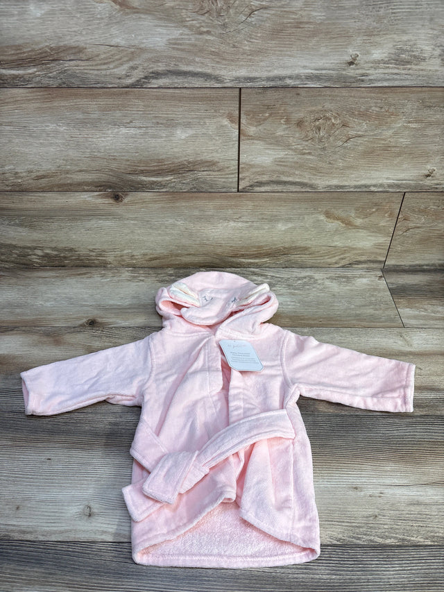 Front view of pink Le Petit Elephant hooded baby bathrobe showcasing attached hood with elephant ears and matching belt on wood floor background