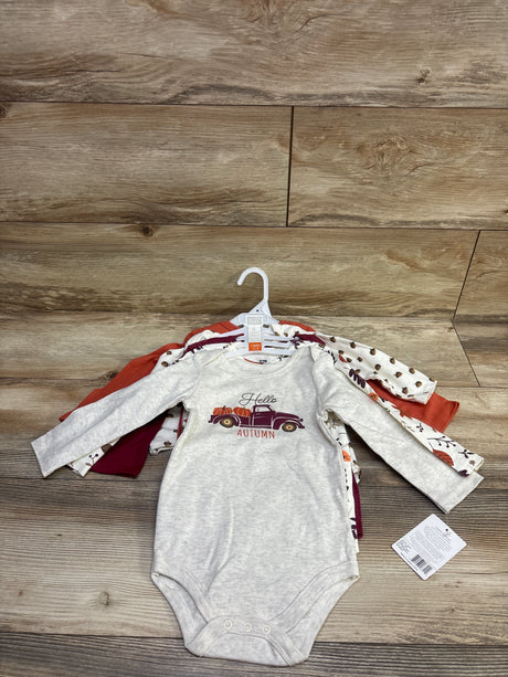 Front view of Hudson Baby five-piece long sleeve autumn bodysuit set in grey, showing seasonal prints on a wood background