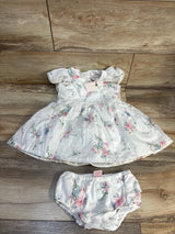 White floral baby dress with matching bloomers, soft cotton, ruffled sleeves, perfect for newborns and infants