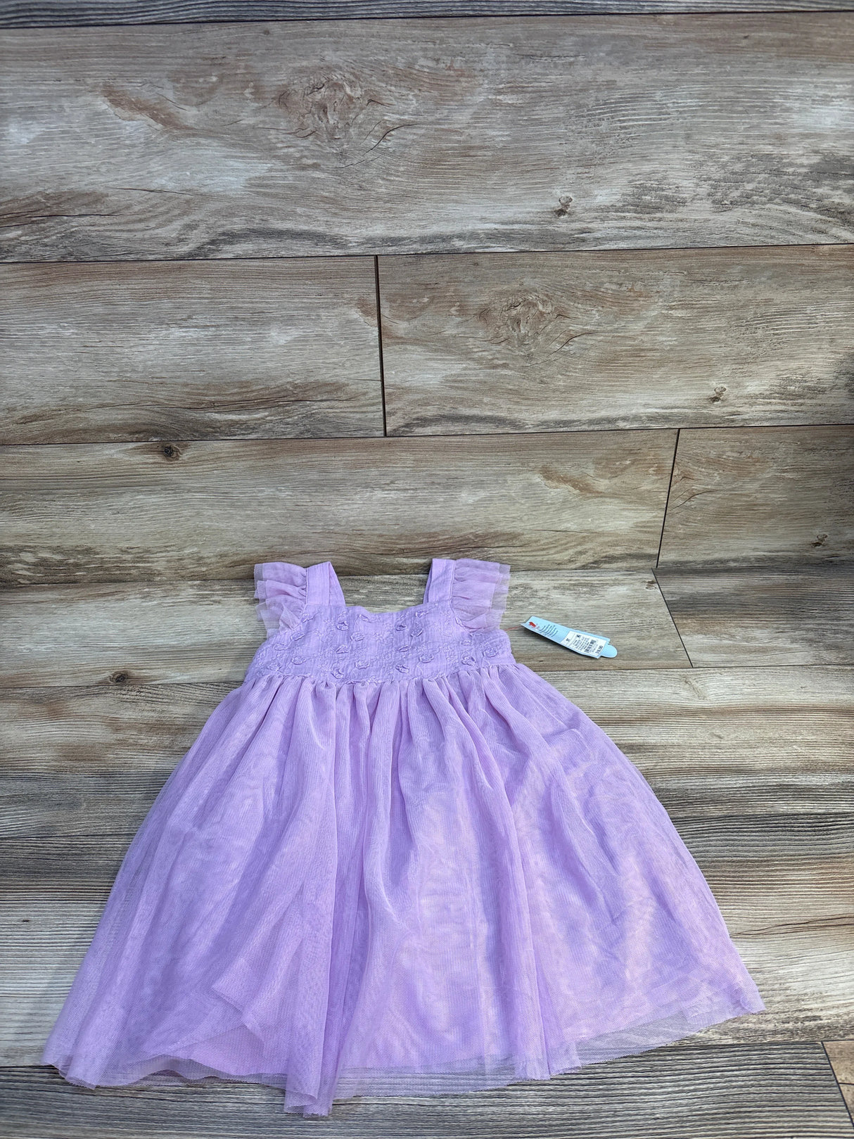 Light purple girls tulle dress with ruffle straps on wood floor, kids resale clothing