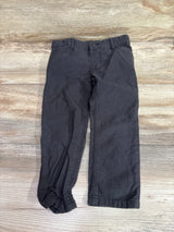 Grey Oshkosh pants for toddlers size 3T laid flat on a light wood background.
