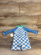 Blue and white checkered baby rash guard with long sleeves, Disney Baby tag, on wood floor