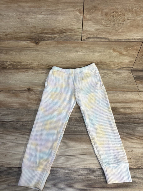 Pastel tie-dye ribbed kids jogger pants on wood background, children's clothing