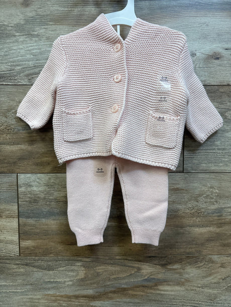 Flat lay of Baby Gap pink 0-3m sweater set with button-front cardigan, pockets, and matching pants on wood