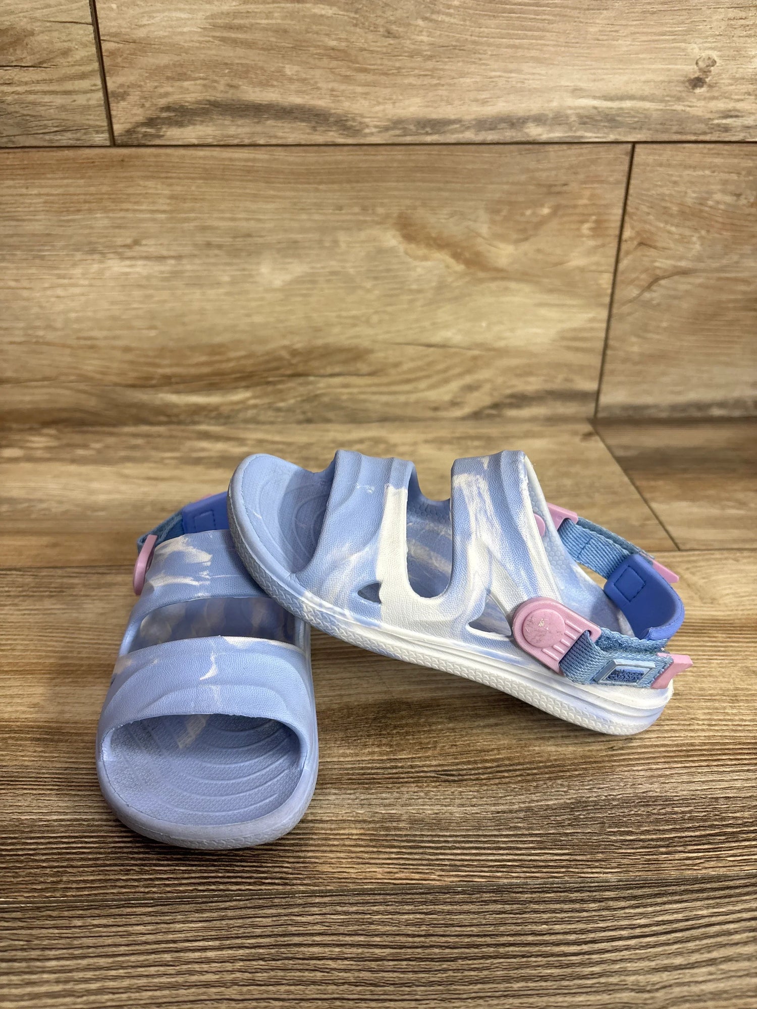 Side view of Rugged Shark toddler sandals in blue showing adjustable strap and textured sole on white