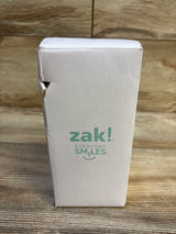 Front view of Zak! Kelso insulated tumbler box showing Zak! logo and torn corner on wood background