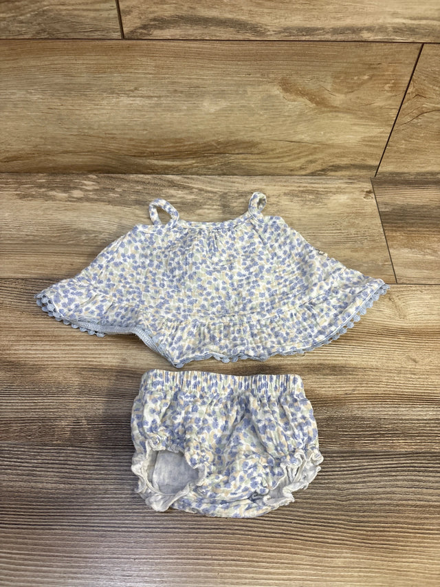 Flat lay of rabbit bear organic tank top and shorts, 0-3M, showing ruffled hem and elastic waist on wood floor