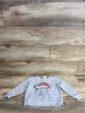 Kids' gray Mickey Mouse Christmas sweater with Santa hat and snowflakes, laid on wood floor