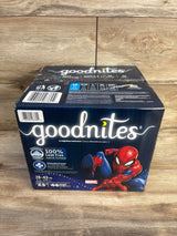 Angled front view of Goodnites Marvel underwear box showing Spider-Man art, XS (28–43 lb) size and 44-count on wood background