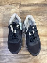 Top view of navy Cat & Jack toddler sneakers showing lace-up front, padded gray inner lining and faux-suede heel on wood floor