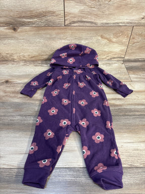 Purple hooded baby romper with pink flower print, laid flat on wood floor