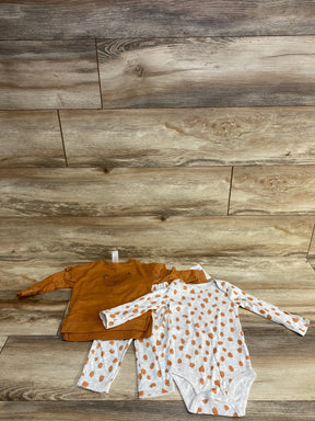 Front view of baby lion sweatshirt set: caramel top with ruffle shoulders and lion face, and polka-dot bodysuit and pants