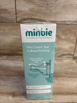 Front view of Minbie 6m+ Feeding Kit box showing headline 'The Closest Teat to Breastfeeding' with wooden floor background