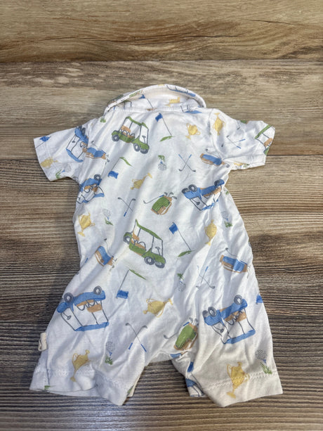 Baby romper with golf cart, golf club, and trophy print on wood background
