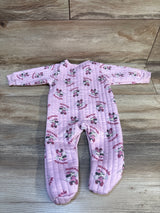Pink baby sleeper featuring Minnie Mouse print, long sleeves, and quilted fabric on wood floor
