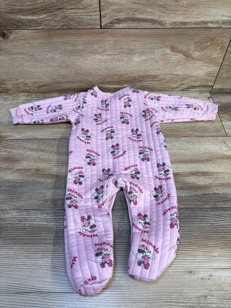 Pink baby sleeper featuring Minnie Mouse print, long sleeves, and quilted fabric on wood floor