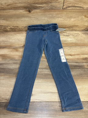 Blue toddler girl jeggings with elastic waistband displayed on wood floor