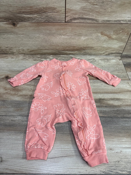 Front view of pink floral Huggies sleeper showcasing long sleeves and full-length zipper on a wood-look background