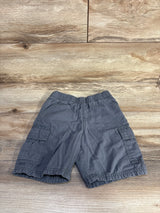 Flat lay of grey Children's Place pull-on cargo shorts showcasing elastic waistband and side cargo pockets on a wood background