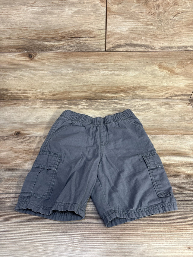 Flat lay of grey Children's Place pull-on cargo shorts showcasing elastic waistband and side cargo pockets on a wood background