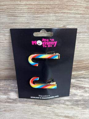 Rainbow candy cane hair clips for kids, colorful holiday accessories on black card