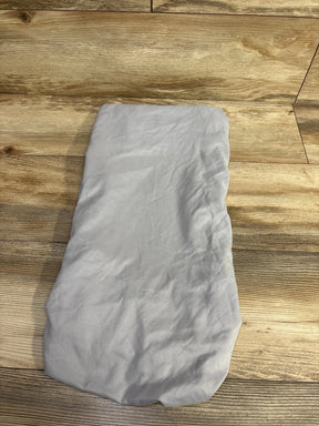 Light gray baby changing pad cover on wooden floor, children's nursery accessory