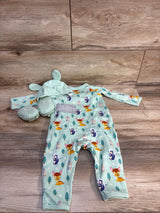 Baby romper set with deer print, mint hat with ears, and matching booties on wood floor