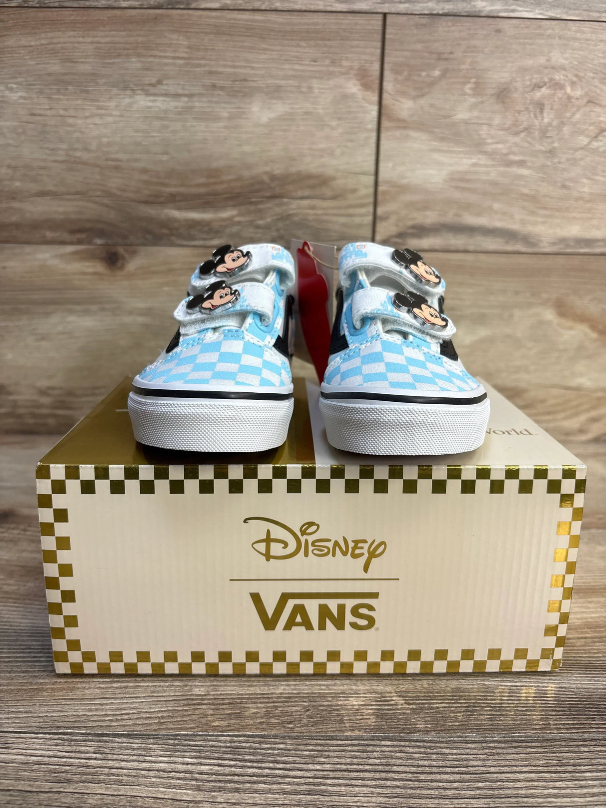 Disney Vans toddler sneakers with Mickey Mouse design and blue checkered pattern