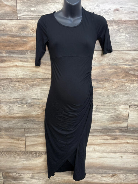 Front view of Isabella Oliver black maternity short-sleeve midi dress showing side ruching and tulip wrap hem on mannequin