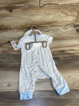 Blue and white baby sleeper with cloud print and footed cuffs displayed on wood floor