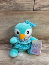 Aqua blue plush penguin toy with yellow beak, bow, ruffled collar, and Scrunch Bunch tag
