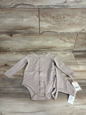 Striped beige long sleeve baby bodysuit with tags, size 12M, on wood background