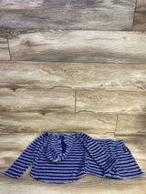 Flat lay of navy striped terry hoodie and matching elastic-waist shorts on light wood background