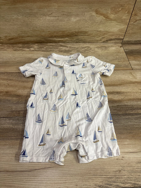 Front view of Angel Dear white bamboo polo shortie romper, size 6-12 months, with sailboat print and collar on wood flooring