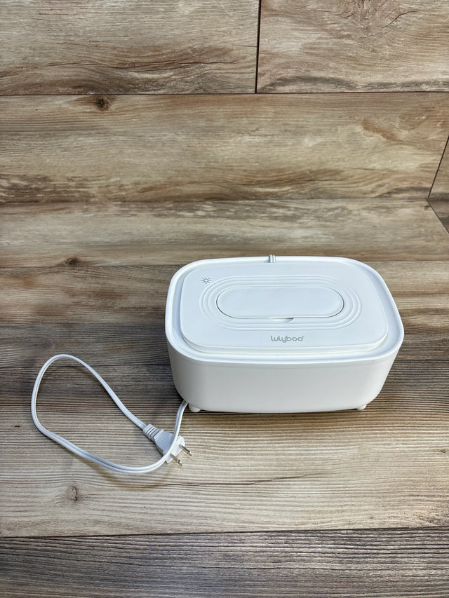 White Lulyboo baby wipe warmer on wooden surface with power cord