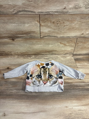 Gray long sleeve kids shirt with realistic cat face print on wood background