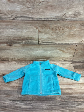 Light blue Columbia fleece jacket for toddlers laid flat on wooden floor