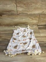 Baby girl's white turtle print dress with floral shells and pom-pom trim, perfect for summer outfits.