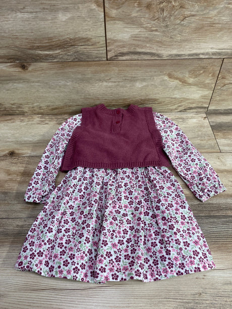 Front view of Nicole Miller 2-piece floral long-sleeve dress and knit vest in pink, size 2T, on a wood background