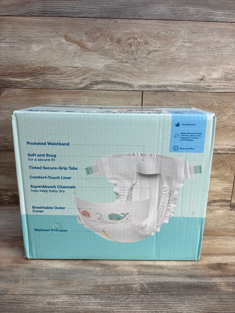Hypoallergenic baby diapers box with whale print, size 2, featuring pocketed waistband and super absorbent channels for baby comfort.