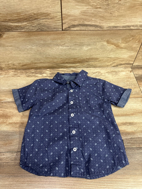 Front view of Ben Sherman blue button-up shirt in size 2T showcasing paisley pattern and short sleeves on a wood floor
