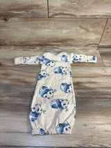 Flat-lay of newborn sleeper gown with blue panda print, long sleeves and elastic bottom opening on wood floor