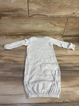 Flat lay of Simple Joys Loved gown showing long sleeves with fold over mitten cuffs and elastic bottom on wood floor