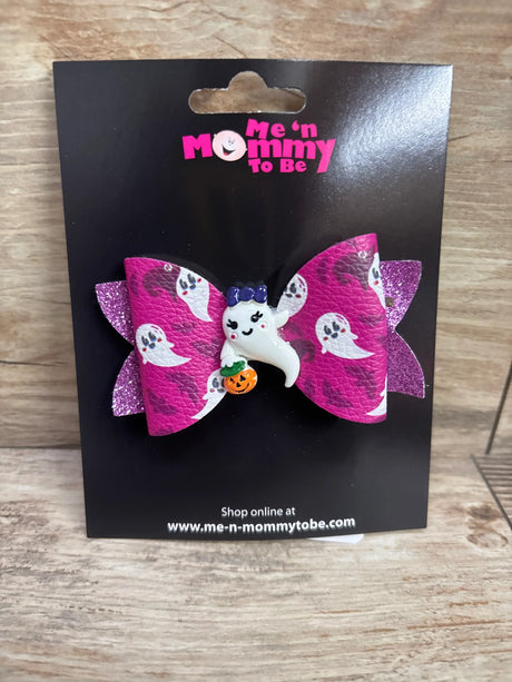 Purple ghost applique hair bow from Me n Mommy To Be on black packaging.