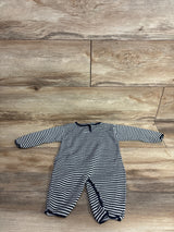 Long-sleeve baby romper with navy and white striped pattern on wood background