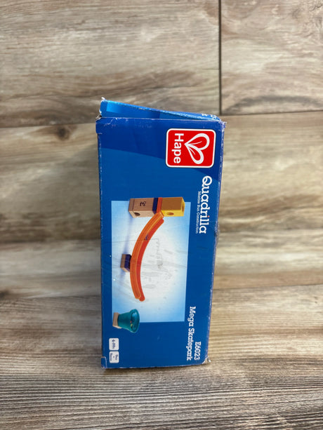 Front view of boxed Hape Quadrilla Mega Skatepark marble-run showing box artwork and light corner wear on wood floor