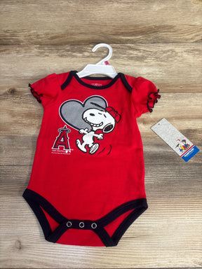 Red Snoopy Angels baby onesie with black trim on wooden background, Peanuts tag visible