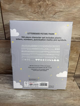 Back of Moon and Stars letterboard frame box showing printed 164-piece character set on gray box on wood surface